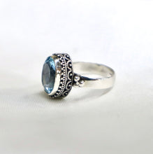 Load image into Gallery viewer, Sterling Silver Bali-Design Ring with Bead Accents set with Faceted Blue Topaz - The Gem Mine