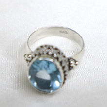 Load image into Gallery viewer, Sterling Silver Bali-Design Ring with Bead Accents set with Faceted Blue Topaz - The Gem Mine
