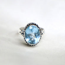 Load image into Gallery viewer, Sterling Silver Bali-Design Ring with Bead Accents set with Faceted Blue Topaz - The Gem Mine