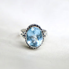 Load image into Gallery viewer, Sterling Silver Bali-Design Ring with Bead Accents set with Faceted Blue Topaz - The Gem Mine
