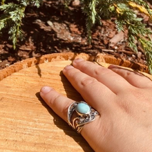 Load image into Gallery viewer, Handmade sterling silver swirl design ring with larimar stone -view of someone wearing it on their pinky
